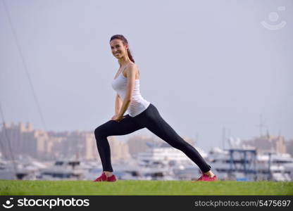 Young beautiful woman jogging and running on morning at park in the city. Woman in sport outdoors health and fitness concept