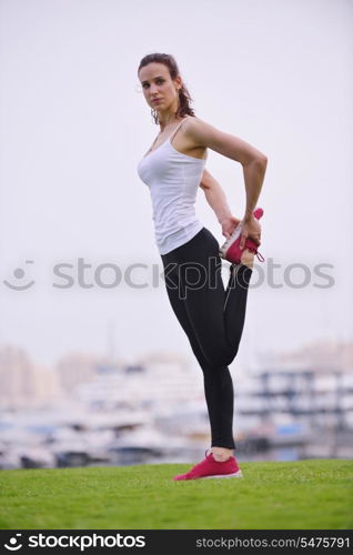 Young beautiful woman jogging and running on morning at park in the city. Woman in sport outdoors health and fitness concept