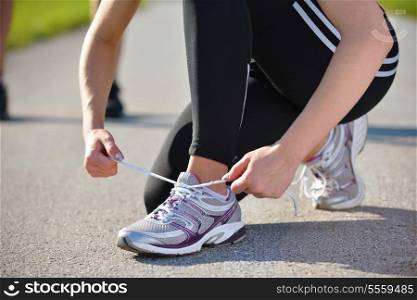 Young beautiful woman jogging on morning at park. Woman in sport outdoors health concept