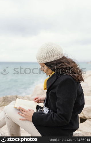 young beautiful woman nature reading book