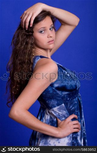 young beautiful woman, on a blue background