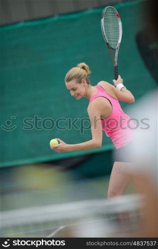 young beautiful woman playing tennis