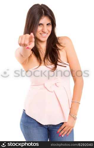 Young beautiful woman pointing at you, isolated over copy space background