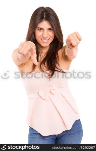 Young beautiful woman pointing at you, isolated over copy space background