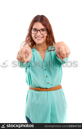 Young beautiful woman pointing at you, isolated over white