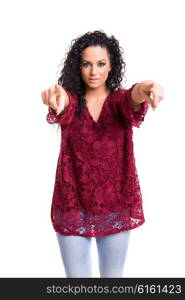 Young beautiful woman pointing at you, isolated over white