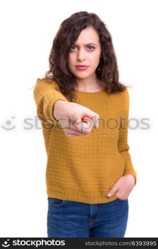 Young beautiful woman pointing at you, isolated over white