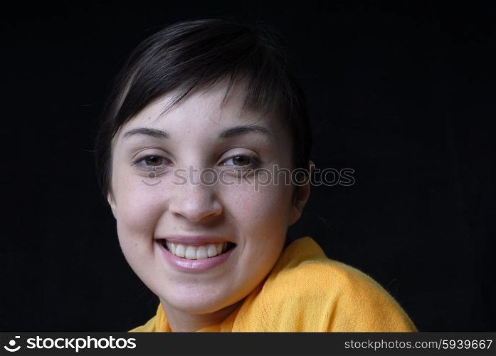 young beautiful woman portrait in black background