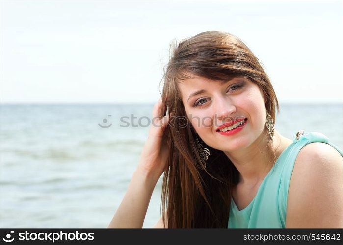 young beautiful woman portrait on the beach