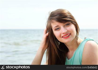 young beautiful woman portrait on the beach