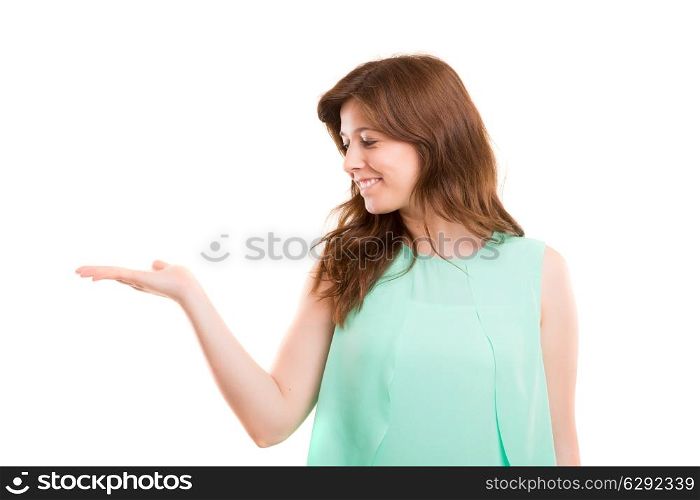 Young beautiful woman presenting your product, isolated over copy space background