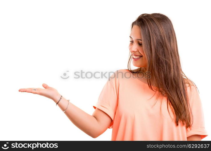 Young beautiful woman presenting your product, isolated over white background