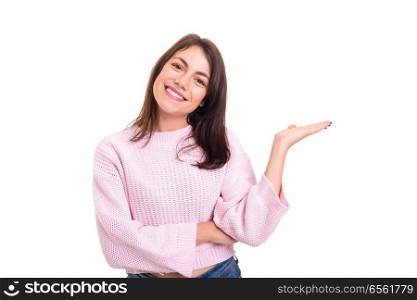 Young beautiful woman presenting your product, isolated over white background