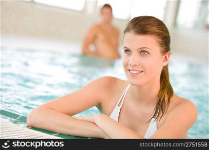 Young beautiful woman relax in swimming pool, wearing bikini