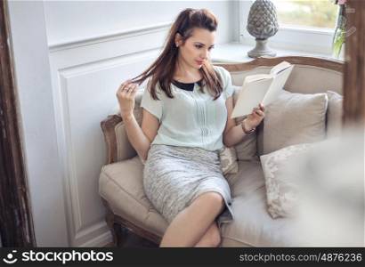 Young beautiful woman relaxing at her place