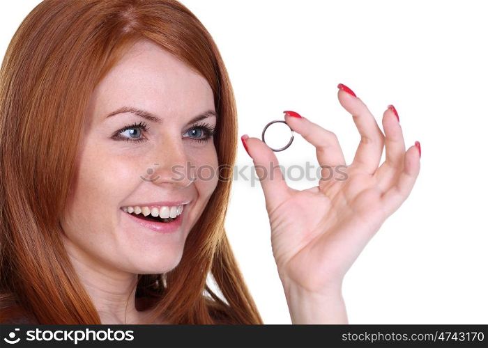 Young beautiful woman showing her engagement ring