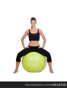 Young beautiful woman sitting on a gymnastic ball on a white background.