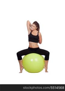 Young beautiful woman sitting on a gymnastic ball stretching arms on a white background.