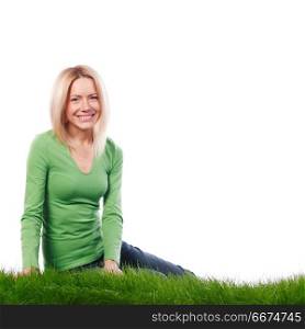 Young beautiful woman sitting on grass, isolated on white background. Young woman sitting on grass