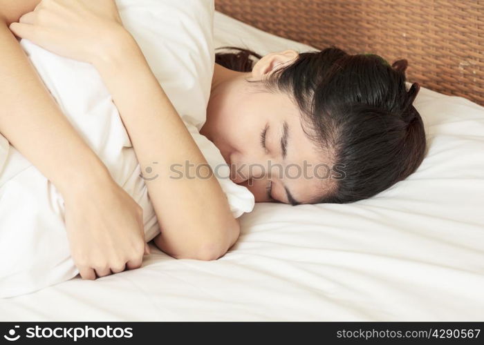 young beautiful woman sleeping in bed