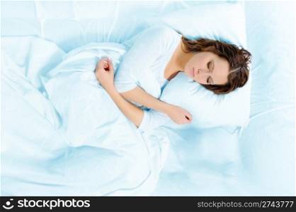 young beautiful woman sleeping on the bed