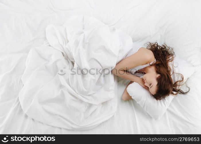 young beautiful woman sleeping on the bed