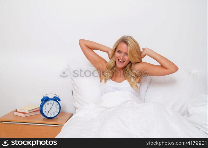 young beautiful woman waking up and when. good mood in the morning in bed,