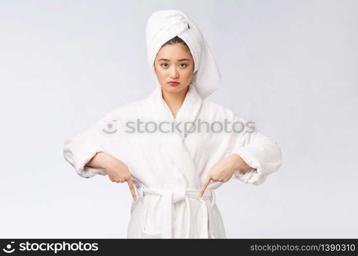 Young beautiful woman wearing shower towel after bath over isolated white background pointing with finger. Young beautiful woman wearing shower towel after bath over isolated white background pointing with finger.