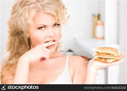 young beautiful woman with burger