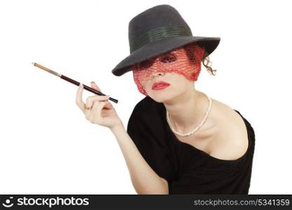 Young beautiful woman with cigarette in mouthpiece in hat with veil isolated on light background