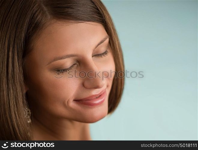 Young beautiful woman with closed eyes with day makeup eye shadows