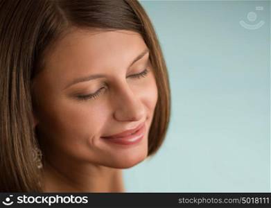 Young beautiful woman with closed eyes with day makeup eye shadows