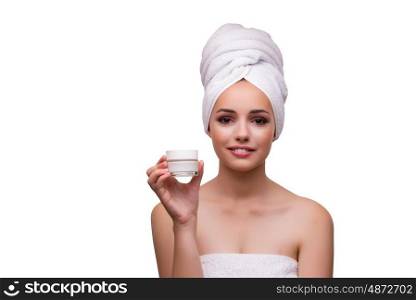 Young beautiful woman with cream isolated on white