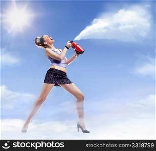 Young beautiful woman with fire extinguisher