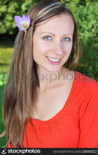 young beautiful woman with flowers outdoor