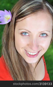 young beautiful woman with flowers outdoor