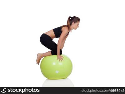 Young beautiful woman with gymnastic ball on a white background.