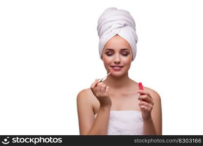 Young beautiful woman with lipstick on white