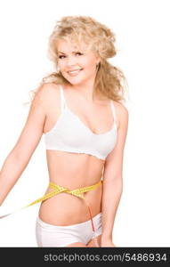 young beautiful woman with measure tape over white