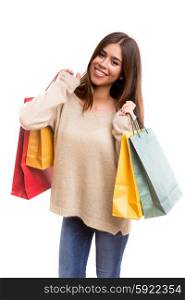 Young beautiful woman with shopping bags, isolated over copy space background