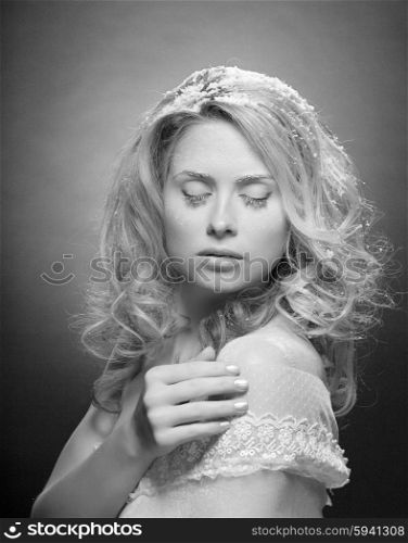 Young beautiful woman with snowy skin (black and white)
