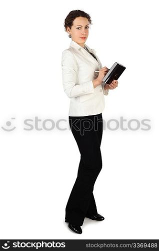young beauty brunette woman in business dress, standing and holding notebook and pen, isolated on white