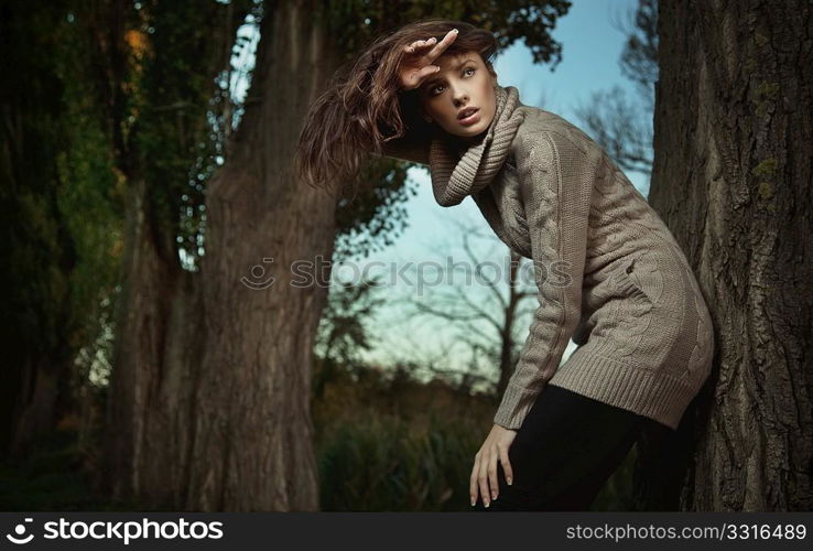 Young beauty in a autumn scenery