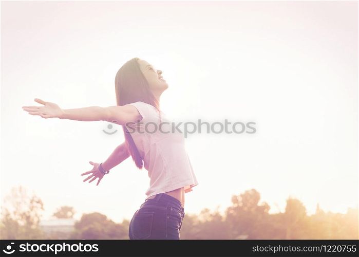 Young beauty woman happy relaxing smile with sunglasses, watch and white cloth blue jean trouser in summer sunset sky outdoor. People freedom style.