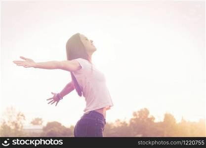 Young beauty woman happy relaxing smile with sunglasses, watch and white cloth blue jean trouser in summer sunset sky outdoor. People freedom style.