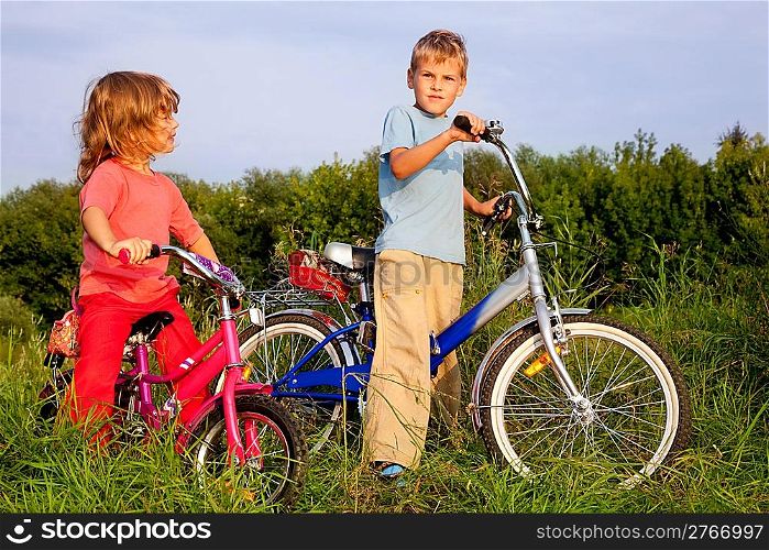 young bikers rest in the field