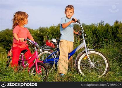 young bikers rest in the field