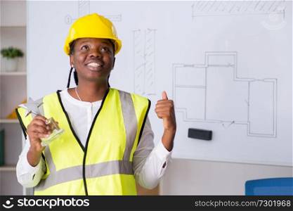Young black architect working on project 