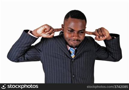 Young black businessman putting his fingers in his ears, dos not liketo hear.