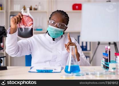 Young black chemist working in the lab 